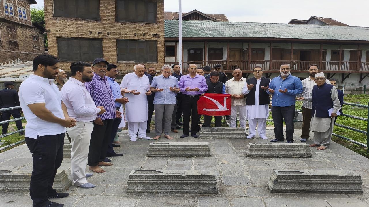 The chief minister then climbed over the main gate and entered the graveyard premises to offer 'fateha'. His security men and several other National Conference leaders also did so before the gate was finally thrown open