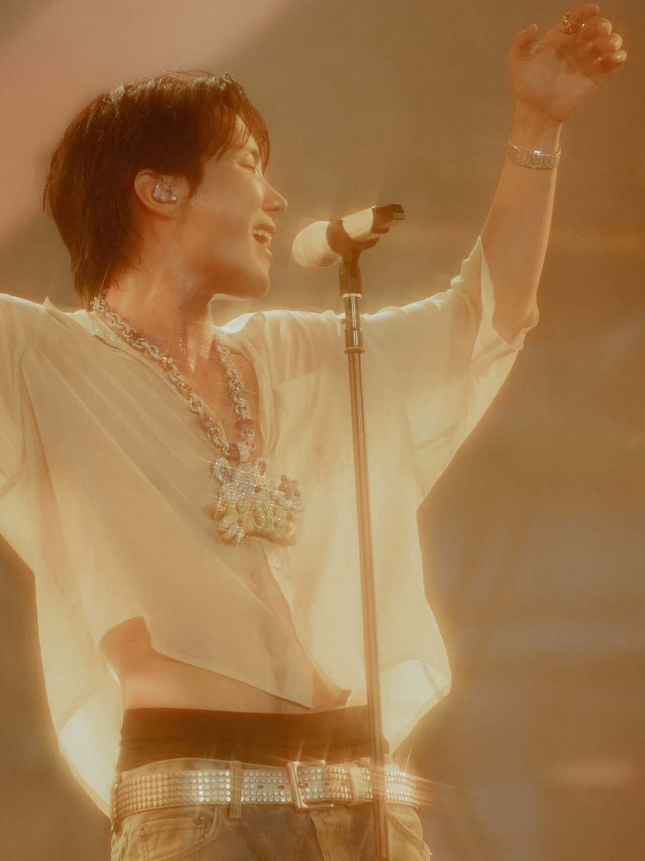 His now-iconic shirt is being called as the ‘useless shirt’ by ARMY members on the internet. He wore a sheer, see-through shirt that quickly got soaked in sweat and did nothing to hide his toned physique. 