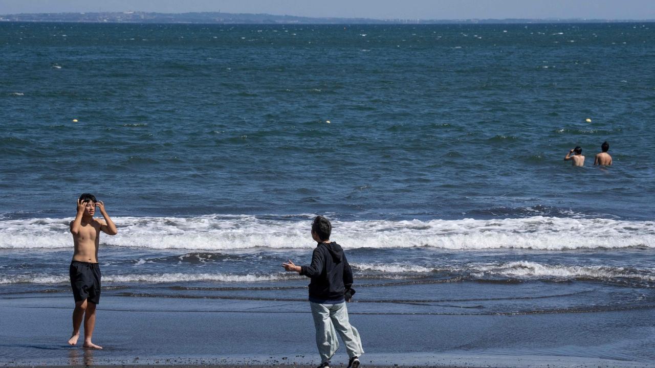 Cars jammed streets and highways in Honolulu as the tsunami alerts coincided with the Tuesday afternoon rush-hour. Warning sirens blared as people moved to higher ground. Hawaii schools cancelled after-school and evening activities