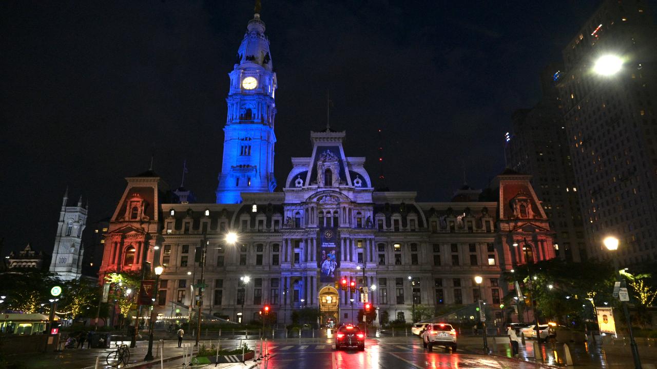 The City Hall building is lit up in the colours of the US national flag on the eve of Independence Day in Philadelphia, Pennsylvania, on July 3