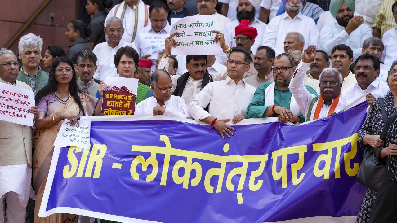 Carrying a banner which read 