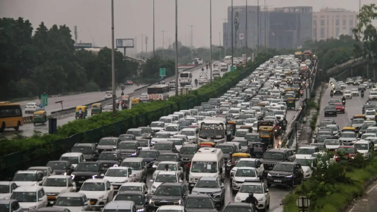 In Photos: IMD issues red alert in Delhi as rains disrupt traffic
