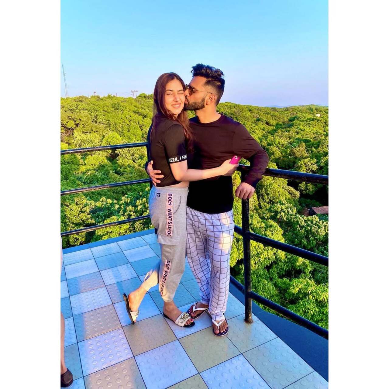 Captured against a lush green backdrop on a tiled balcony, the couple shares a tender embrace, with Rahul planting a kiss on Disha’s forehead.