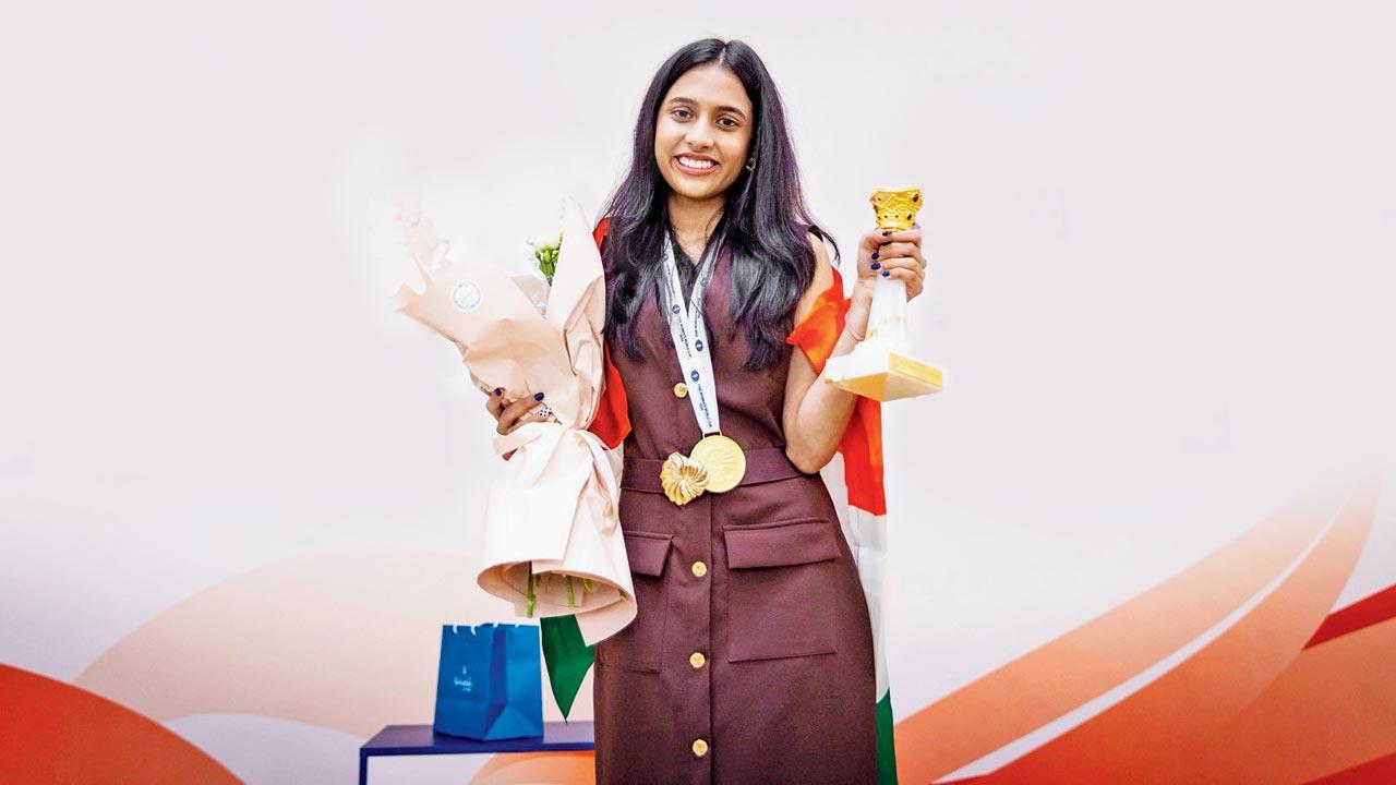 India’s Divya Deshmukh with the winner’s trophy and medal in Batumi, Georgia, on Monday. Pic/FIDE