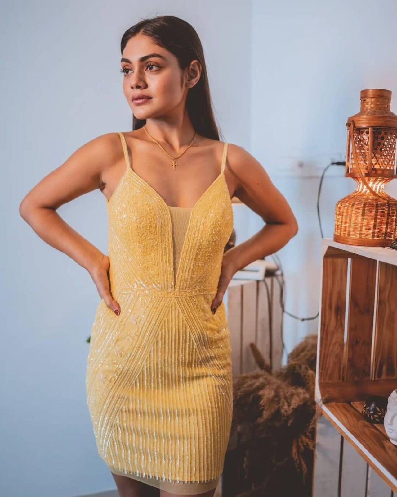 Keeping it simple yet chic, Sreejita looks gorgeous in this yellow mini bodycon dress.