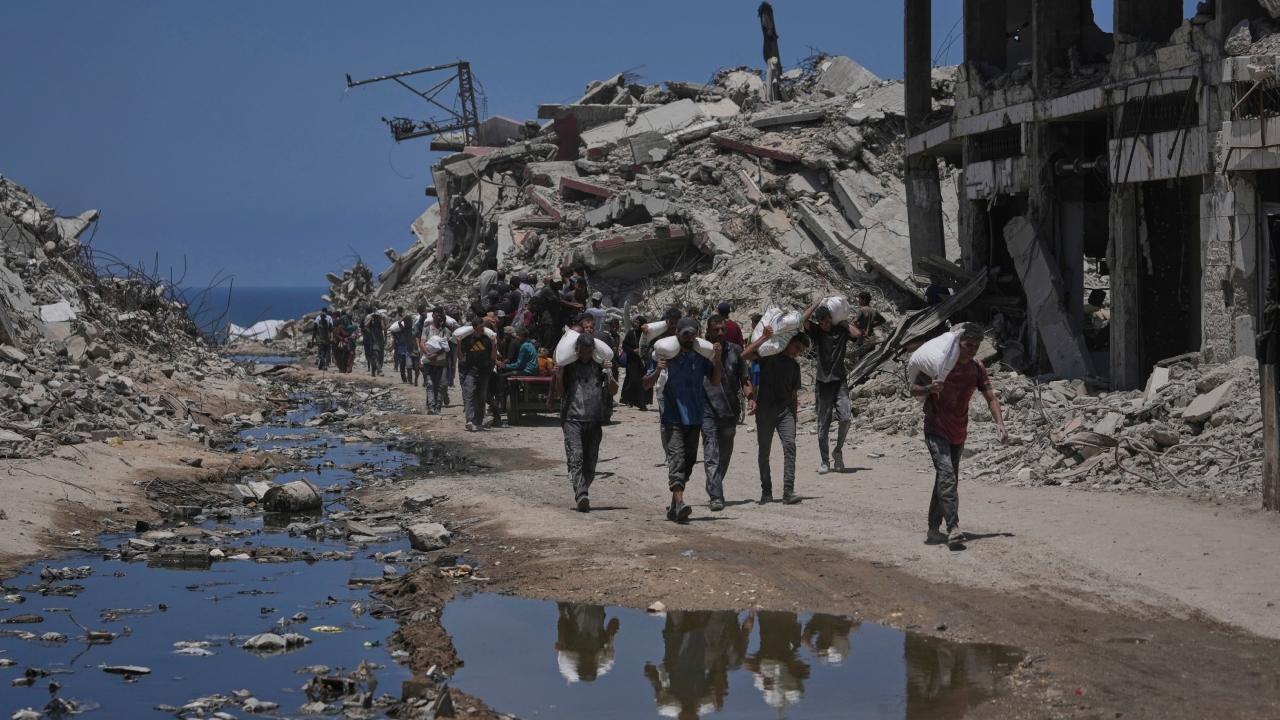 Over 100 aid groups warn of starvation in Gaza as Israeli strikes kill 21