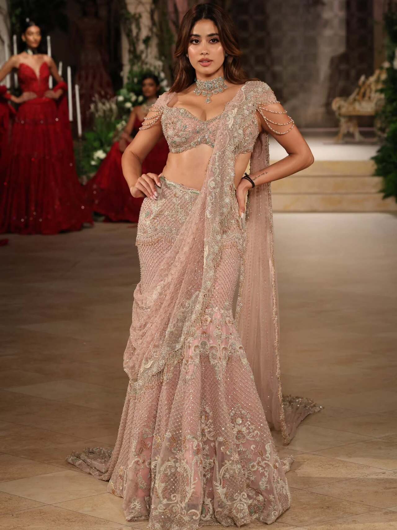 Janhvi Kapoor turned showstopper for Jayanti Reddy at the India Couture Week 2025 on 28th July. She dazzled in a pastel-toned lehenga ensemble crafted in a soft blush shade, which was intricately embellished with shimmering sequins and fine threadwork.
