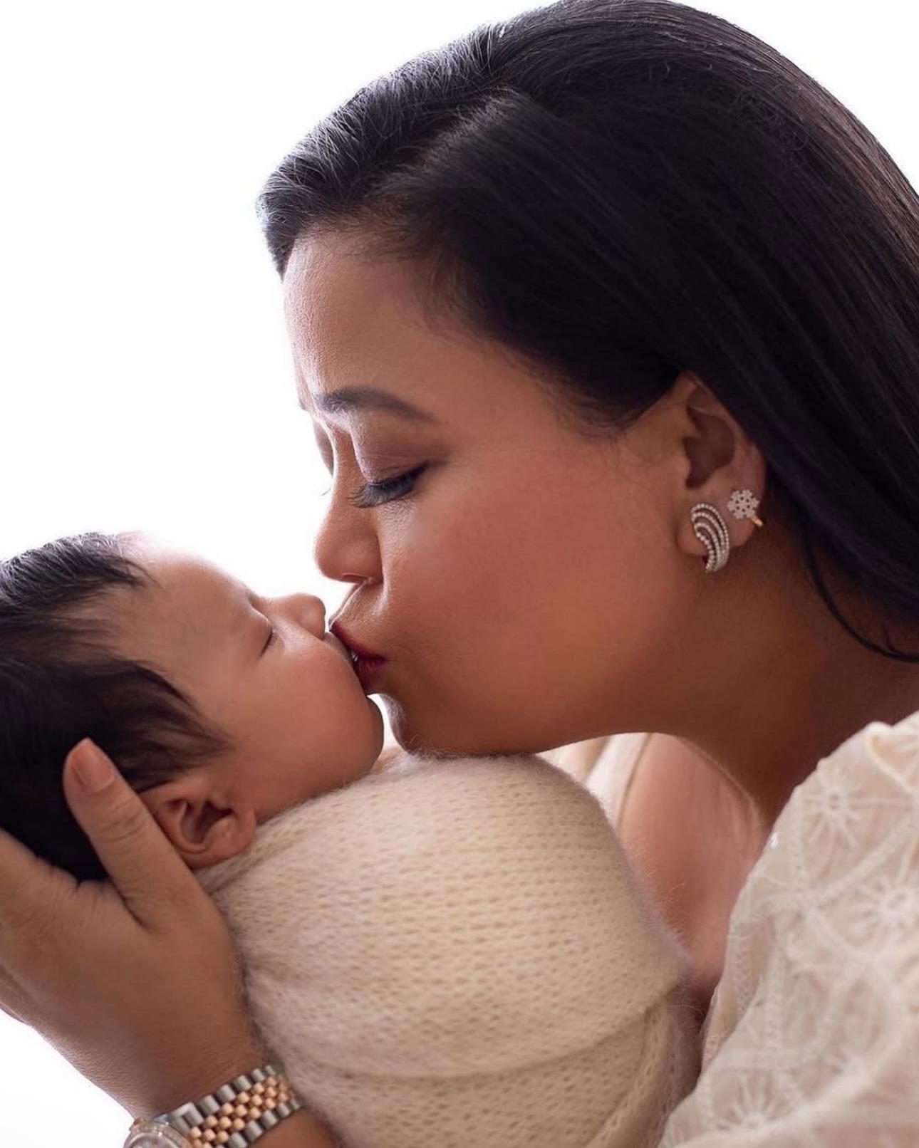 Kiss of life. Bharti kisses her tiny bundle of joy in this picture as if it were her most priced possession and her son definitely is that.