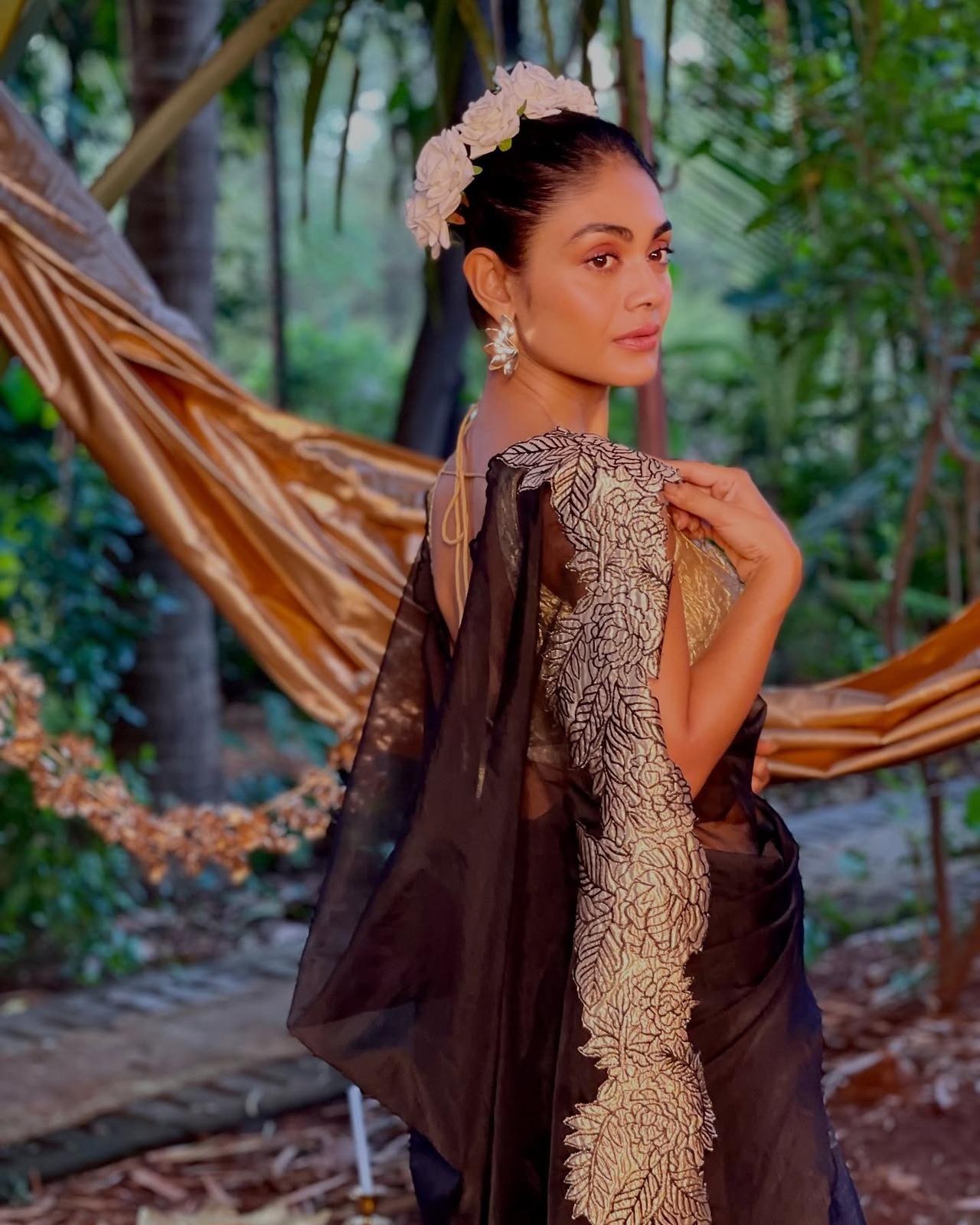 Sreejita experiments with these heavy floral hair accessories and aces it with so much ease. Also, the black and net saree is just beautiful.