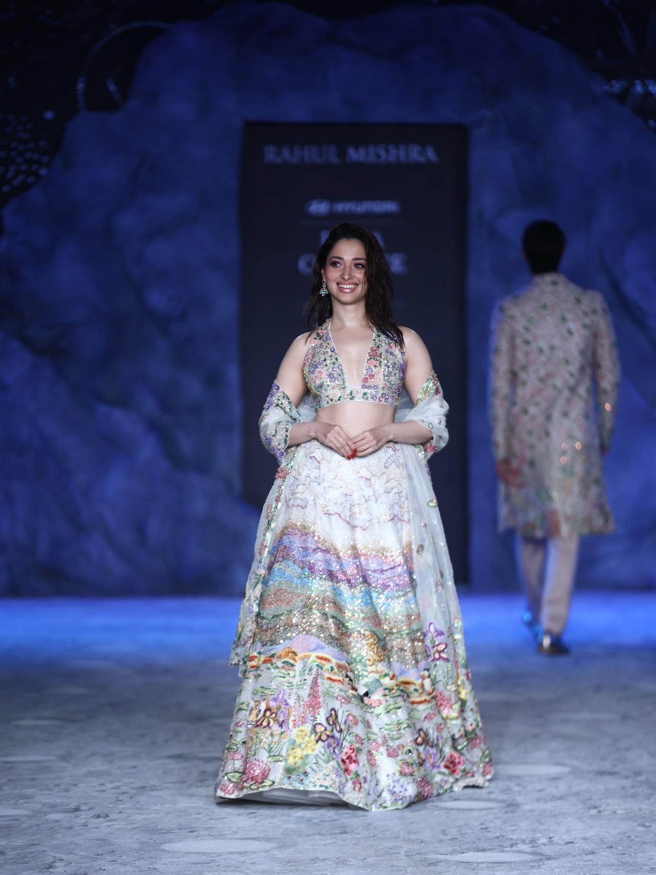 Tamannaah Bhatia's second look was a white lehenga with colourful and floral designs at the bottom. The delicate sequin work added the glam to the look.