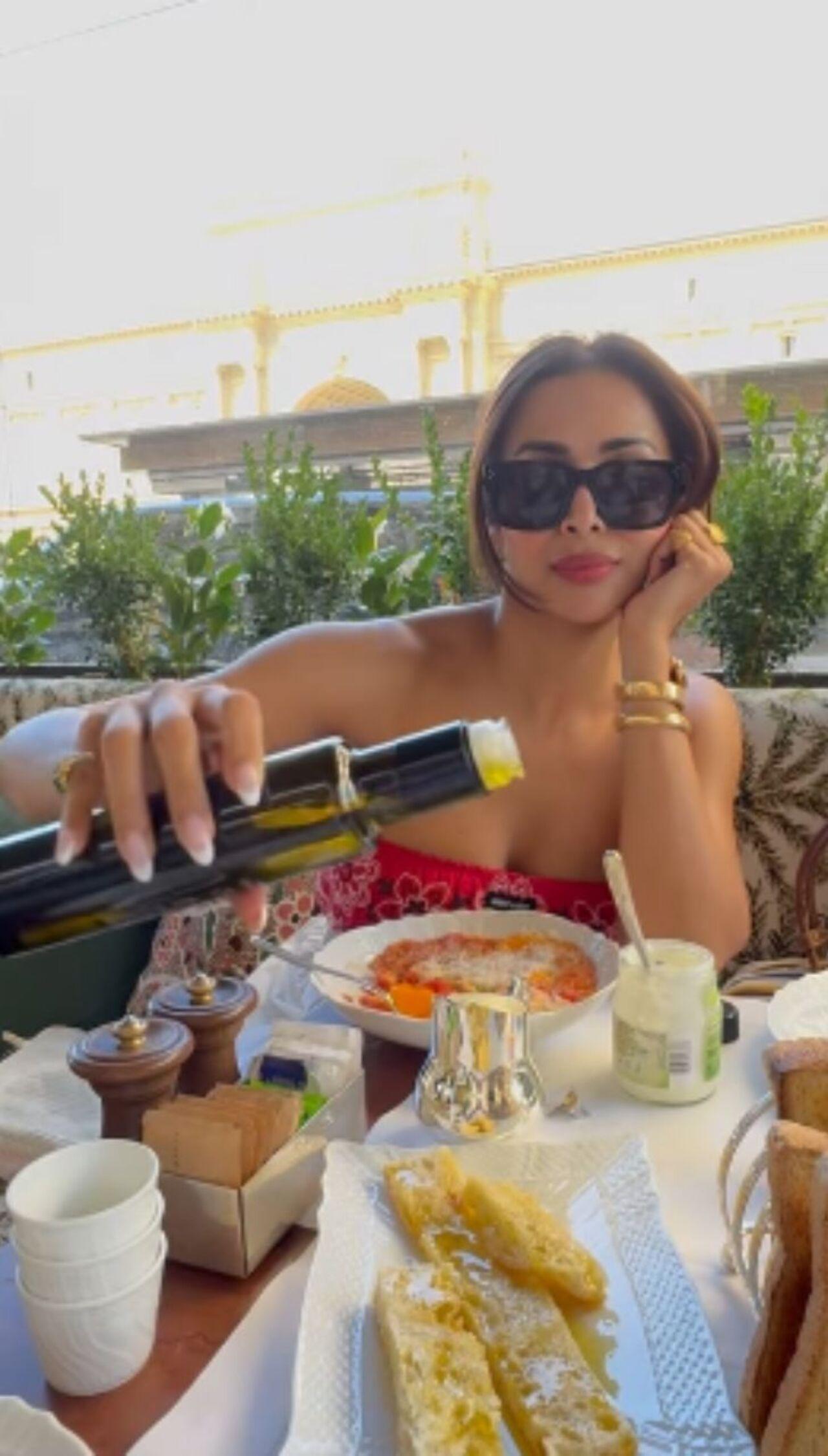 Malaika gives a peek into a scrumptious meal table, while she is busy devouring it