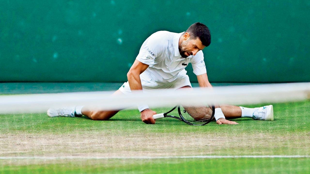Djoko slips, splits, smiles