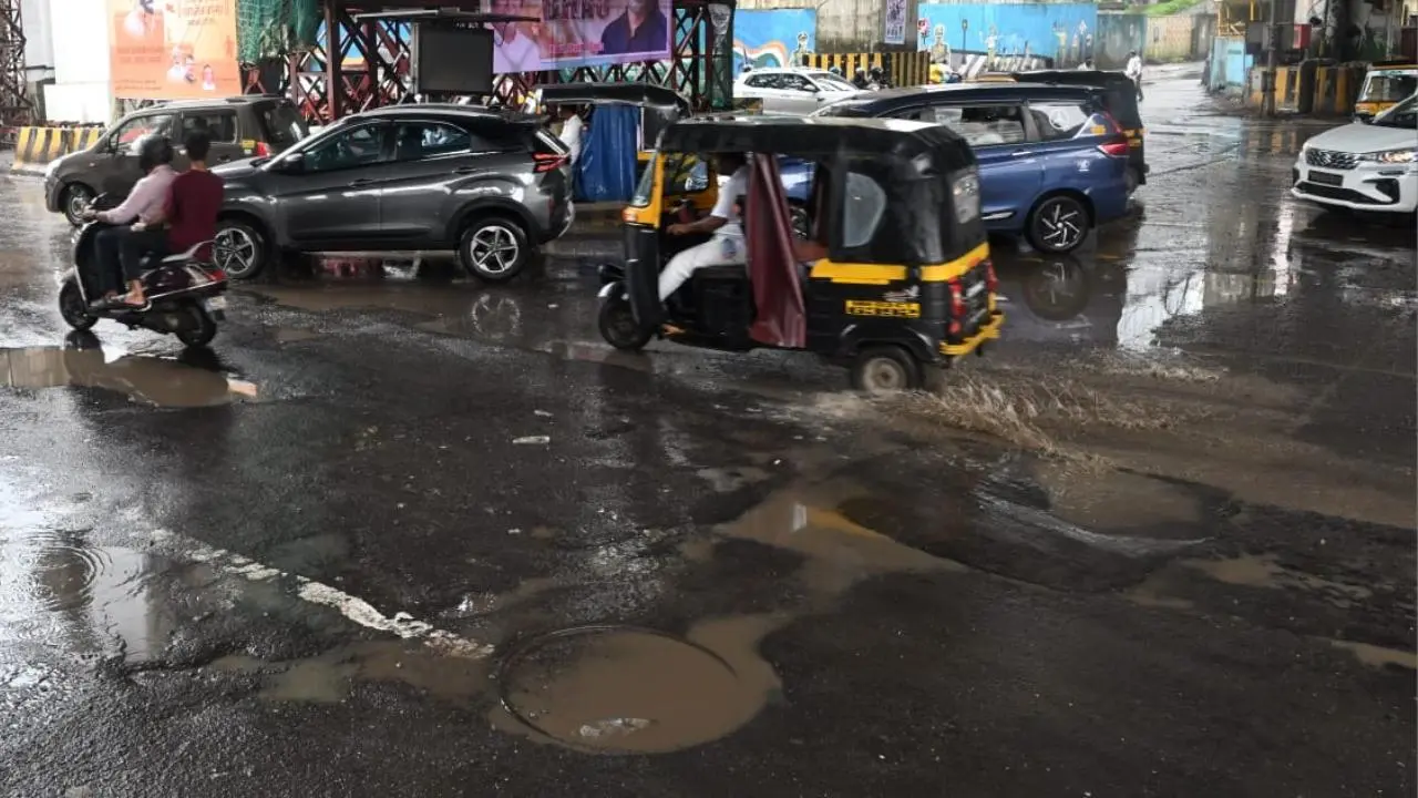 IN PICS: Vehicles wade through potholes on Lal Bahadur Shastri Marg in Vikhroli
