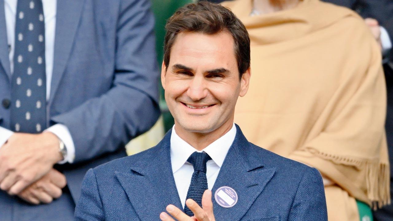 Swiss legend Roger Federer cheers for his former rival Novak Djokovic at Wimbledon yesterday