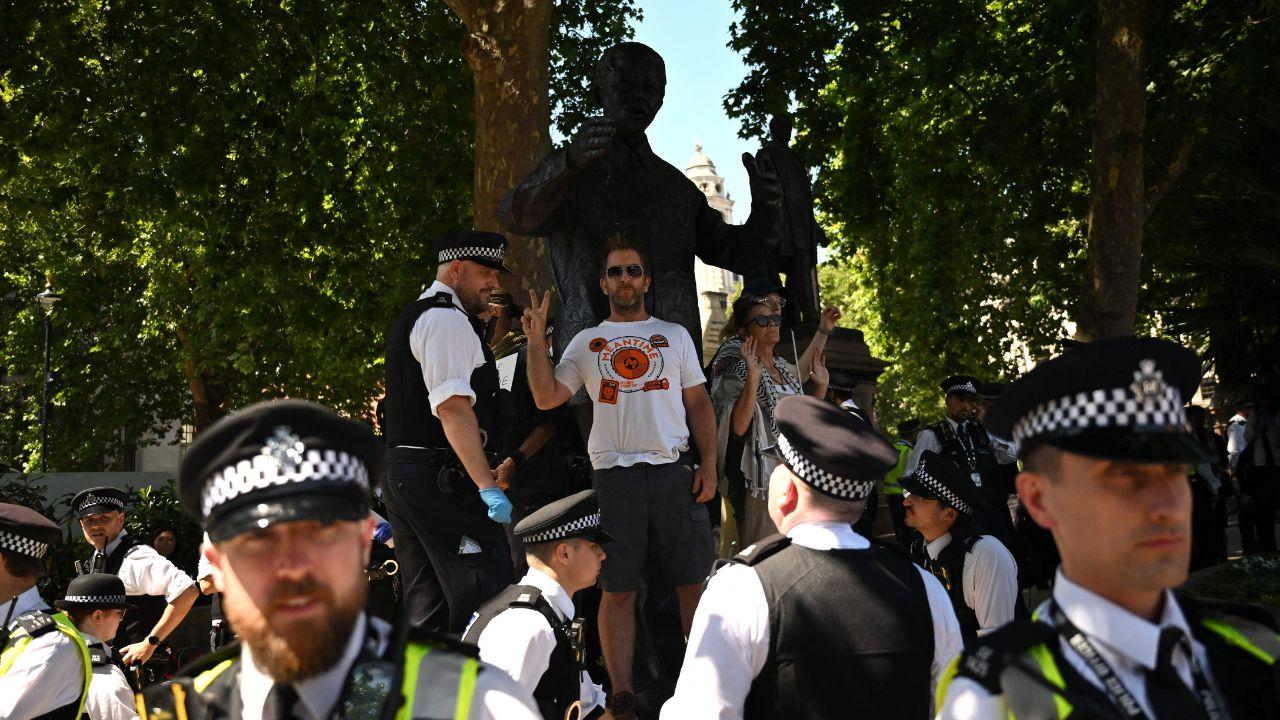 Officers could then be seen carrying away a number of protesters who were lying down, lifting them off the ground and into waiting police vans parked around the square