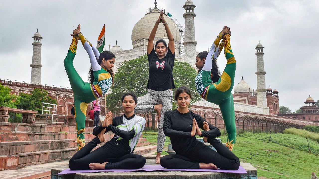 Women perform yoga at Dussehra Ghat behind Taj Mahal in Agra, Uttar Pradesh
Celebrated globally since 2015, the 2025 edition marks the 11th year of International Yoga Day
