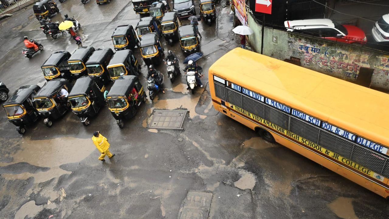 Vehicles were passing through potholes on Akurli Road near the subway in Kandivali (East).