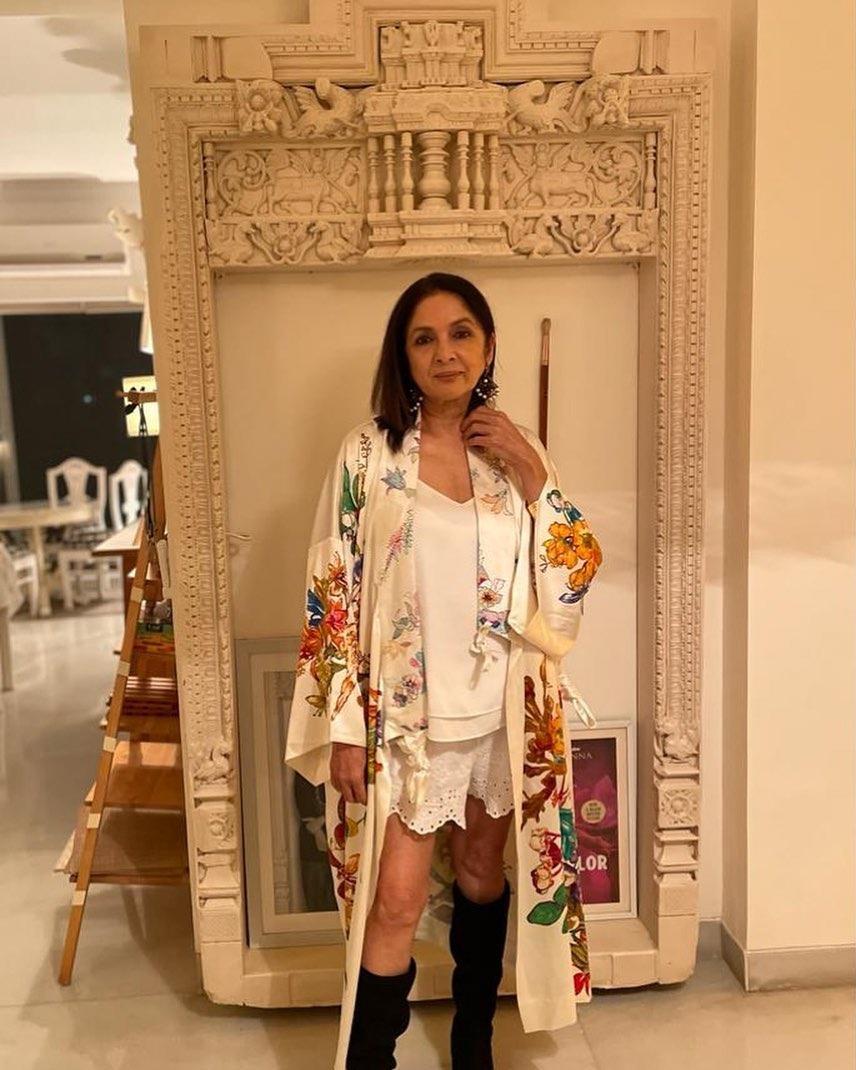 We're a fan of how Neena carries the overcoat looks, wearing short dresses or pants underneath. This is just one example of how she can make it look chic and stylish.