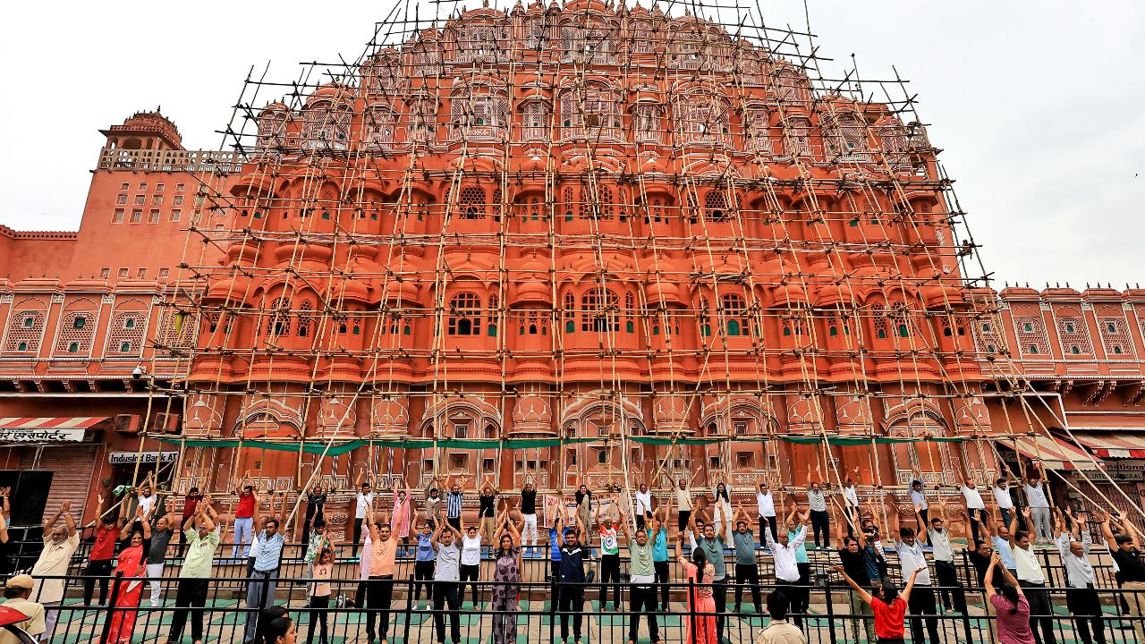 People perform yoga at Hawa Mahal in Jaipur
International Yoga Day not only encourages people to explore the wellness and spiritual potential of this ancient practice but also to adopt it in their everyday lives