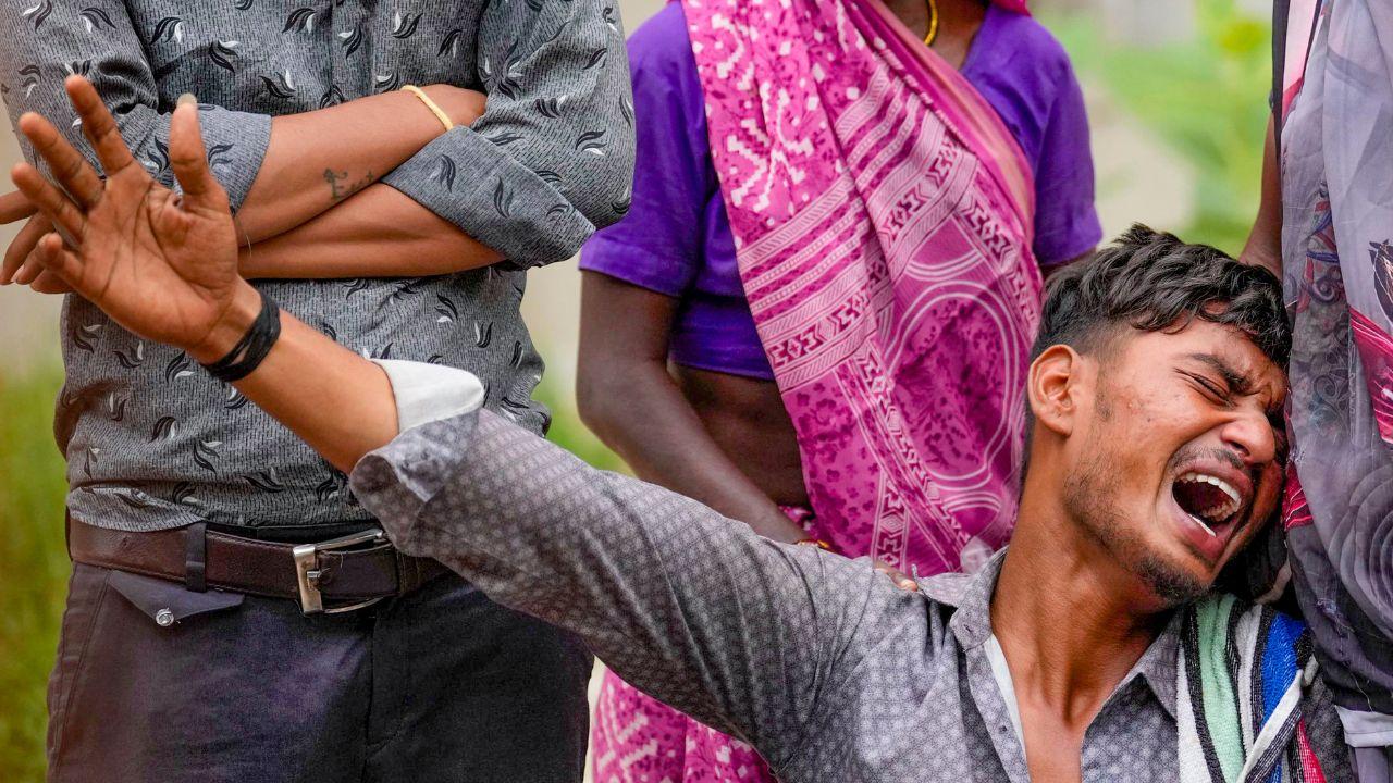A grieving relative breaks down outside the hospital in Ahmedabad as families await the identification of victims from the Air India plane crash