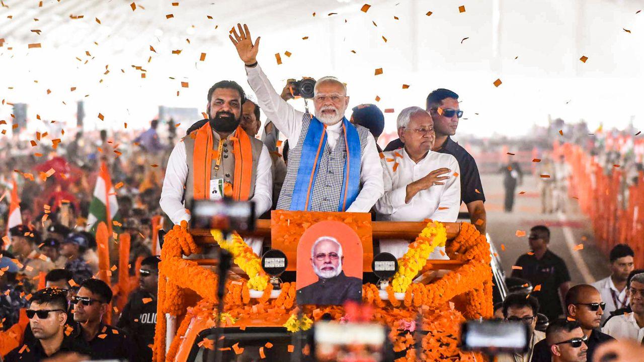 The vehicle in which PM Modi reached the venue was painted in saffron, a colour that has become emblematic of the BJP. It was also decked with flowers. The PM's convoy made its way amid chants of 
