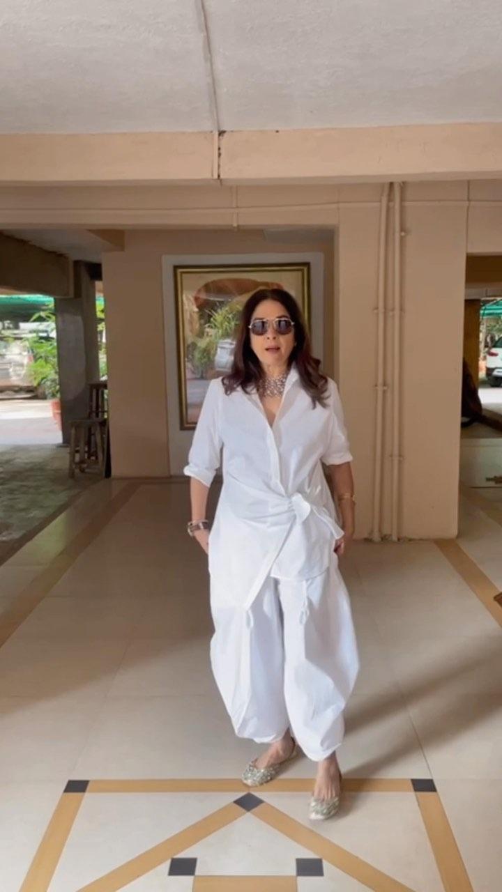 Styling a white co-ord set may not be everyone's cup of tea. But for Neena, it is certainly a cakewalk. We love how she pulls off the unique combination of shirt and the flared patiala pants.