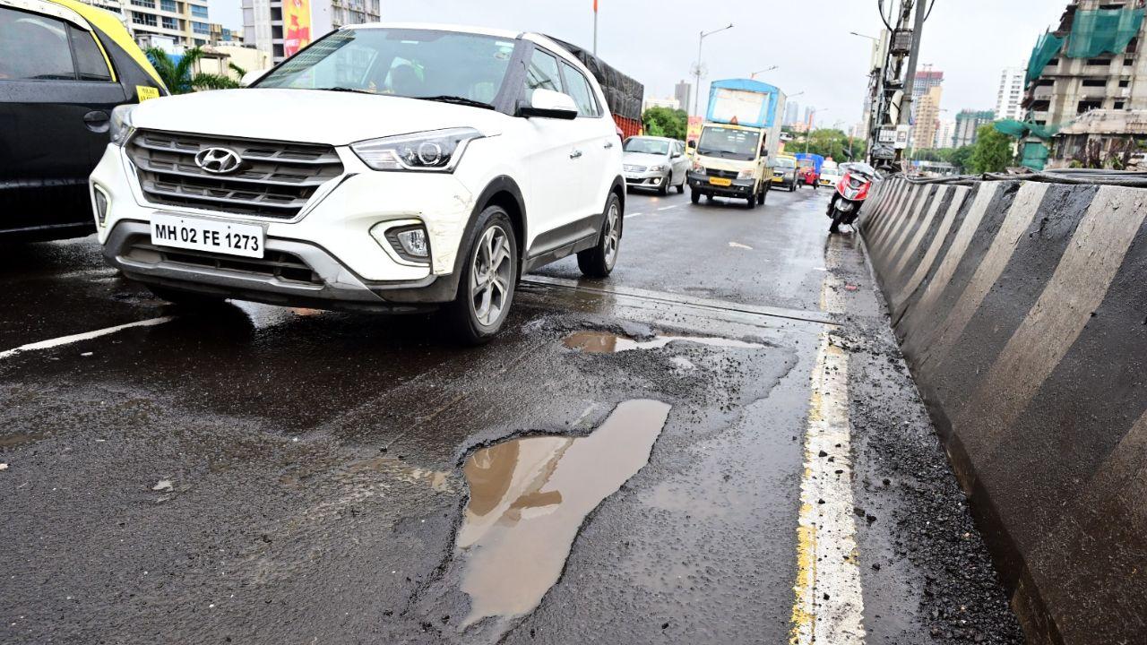The pictures depict that there are more than 40 potholes on the Sion Chunabhatti Flyover in Mumbai.