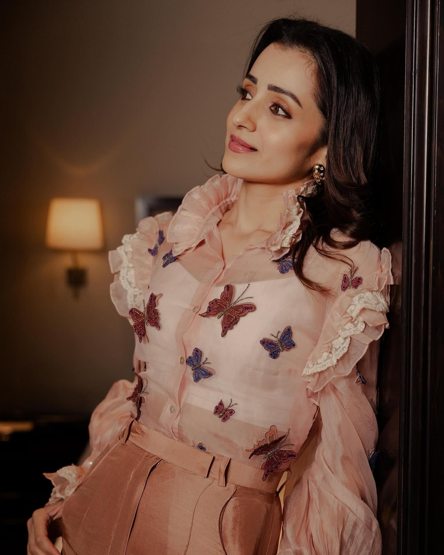 Trisha kept it casual yet chic in this butterfly sheer shirt with frills. She paired it with silk pants, which added a glam quotient to the look. She kept her makeup minimal and natural.