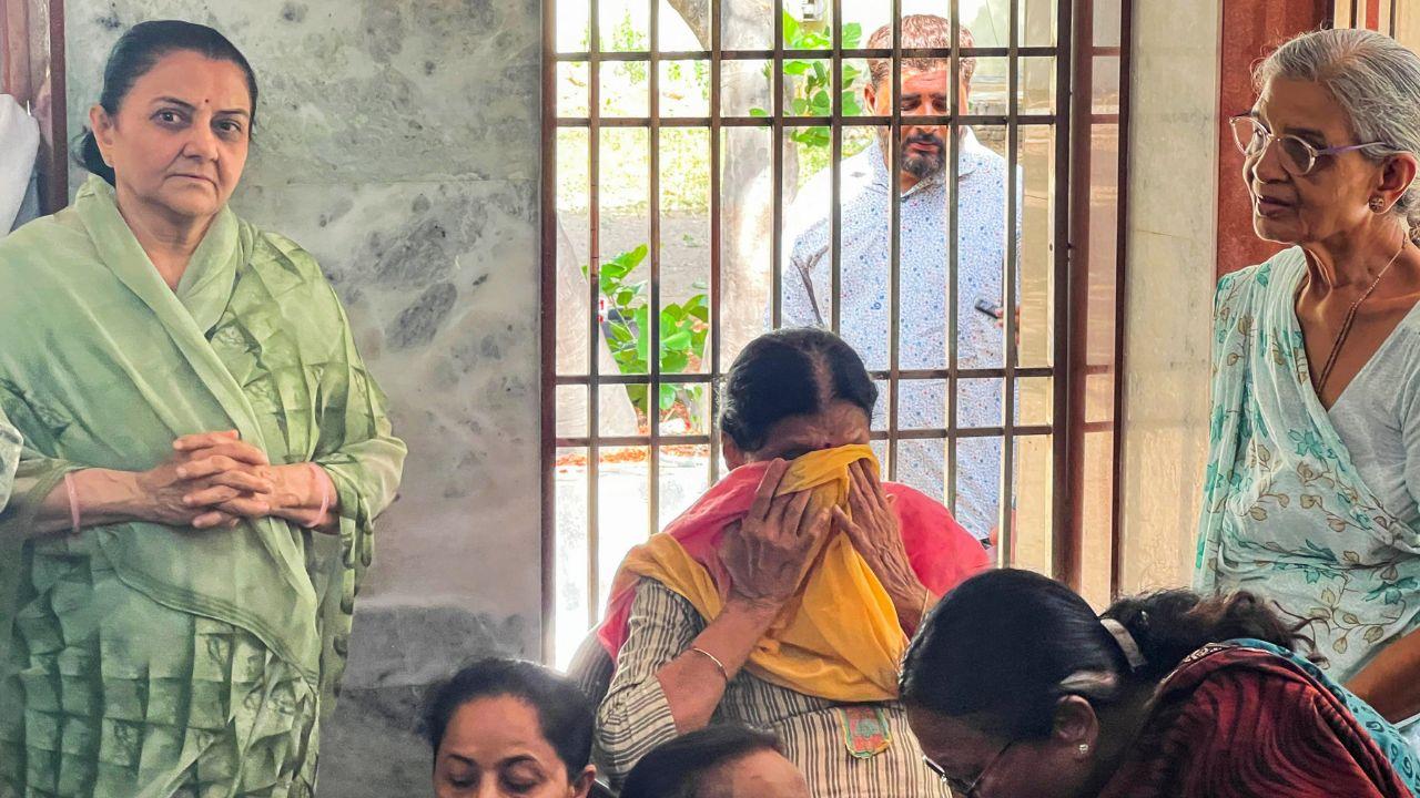 Relatives of Air India crash victims wait in anguish at the hospital as authorities carry out DNA sampling to identify the deceased