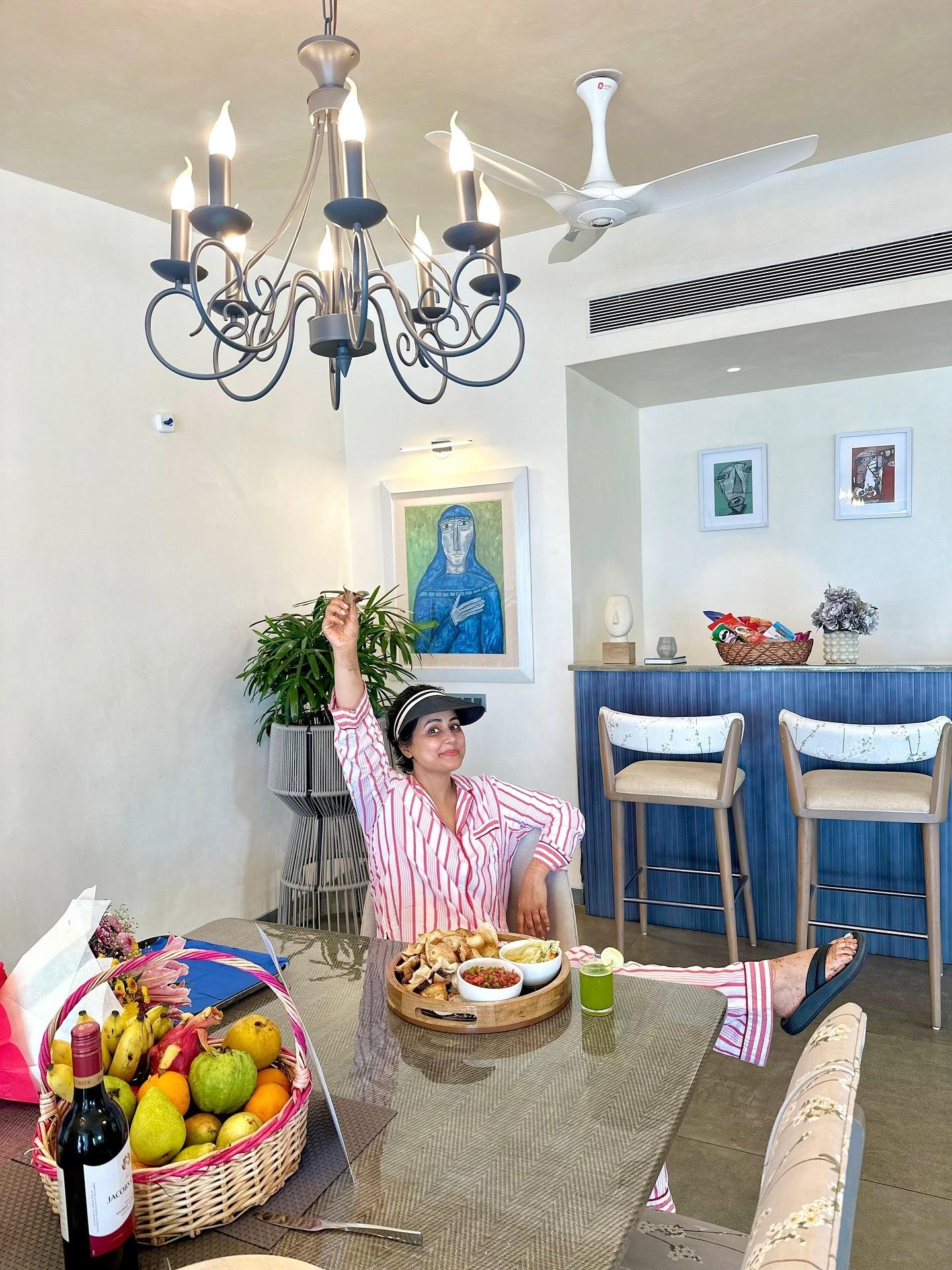 Huge spreads of breakfast on vacation hit differently. That's seen in Hina picture as she happily enjoys breakfast in her Santorini-style villa.