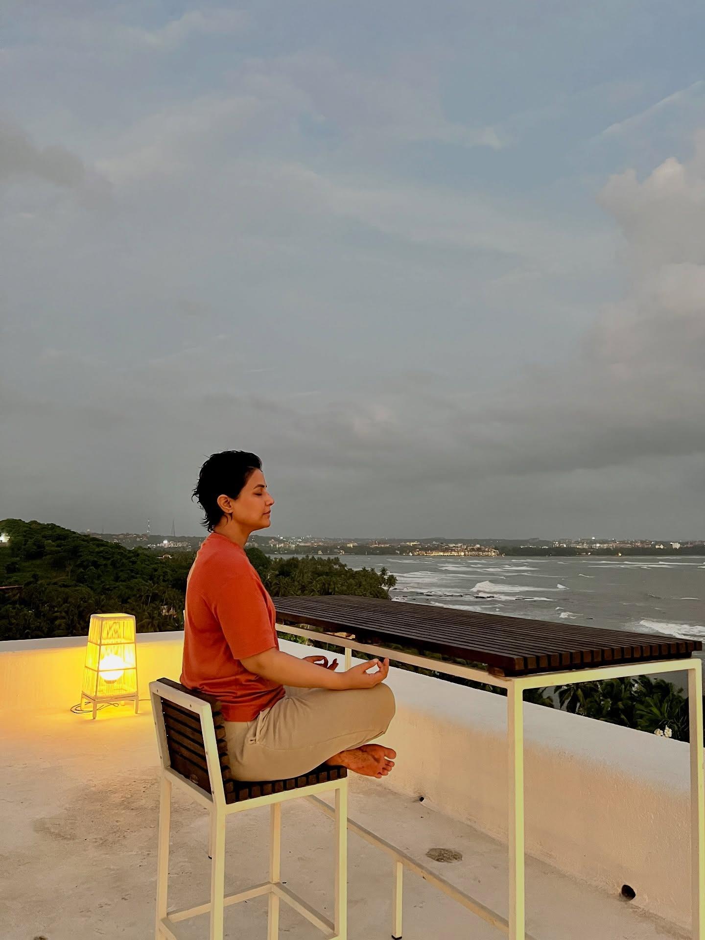 In this picture she is seen meditating while overlooking the sea. Indeed, what a peaceful sight!