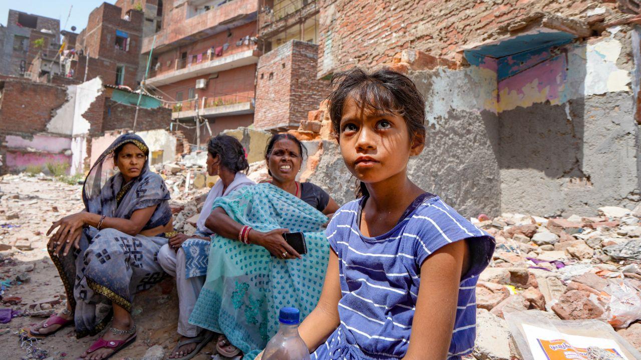 The pictures show how residents are left in disstress after bulldozer demolishes their residential premises in Delhi after the High Court's order.