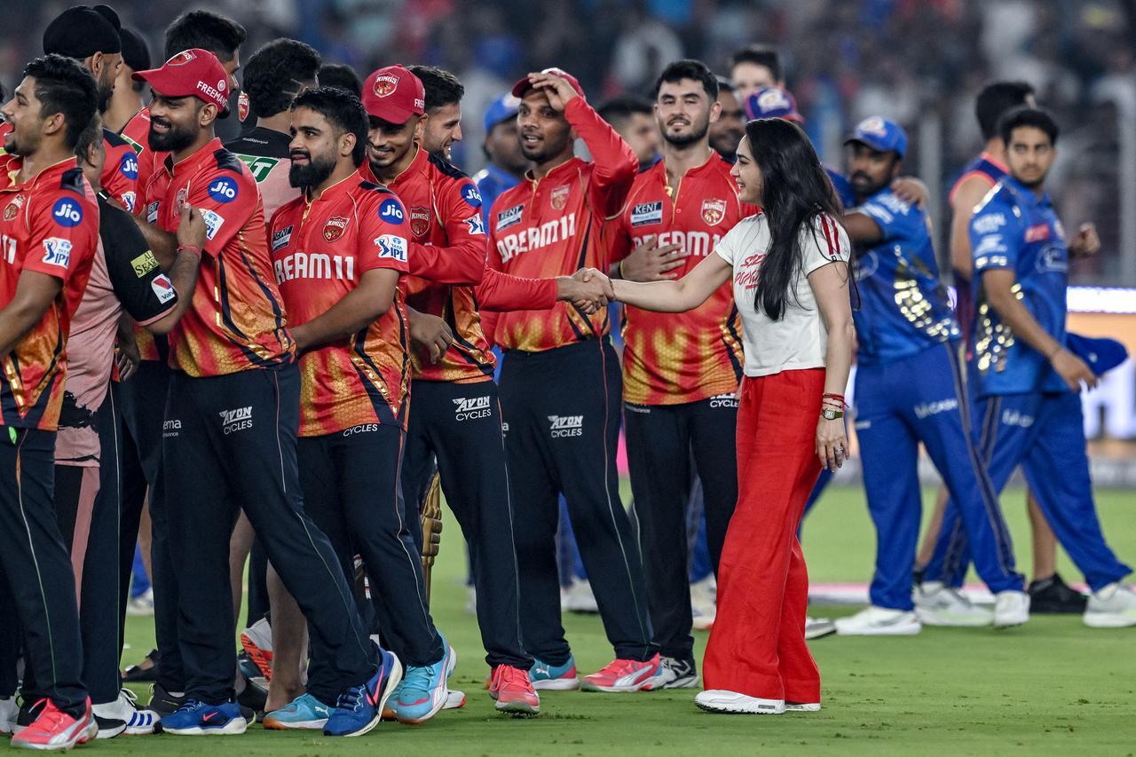 The co-owner, Preity Zinta, celebrates with the entire Punjab Kings team after their win, rocking a simple white tee and red palazzo pants. She’s the ultimate cheerleader, owner, and fan PBKS could ever ask for