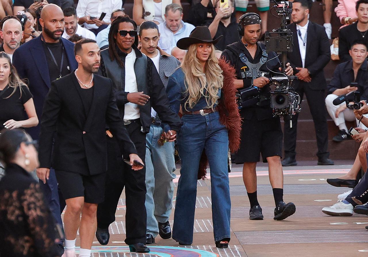 Beyoncé and Jay-Z 
Beyoncé and Jay-Z arrived in style at the Louis Vuitton show, shortly after making history by performing Crazy in Love together on stage for the first time in six years