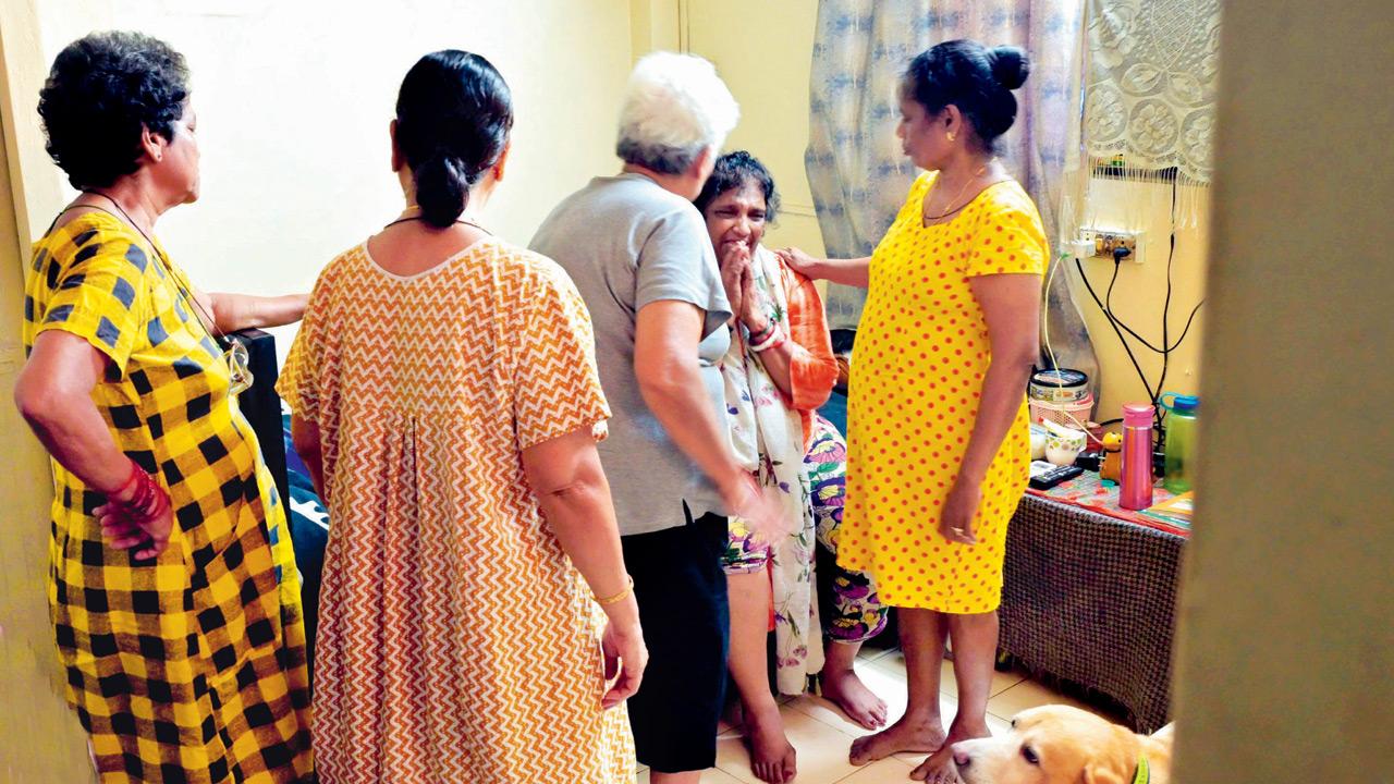 Rema Chakravarti (seated), mother of Saineeta, being consoled by neighbours at their Juhu Koliwada home. Pics/Sayyed Sameer Abedi