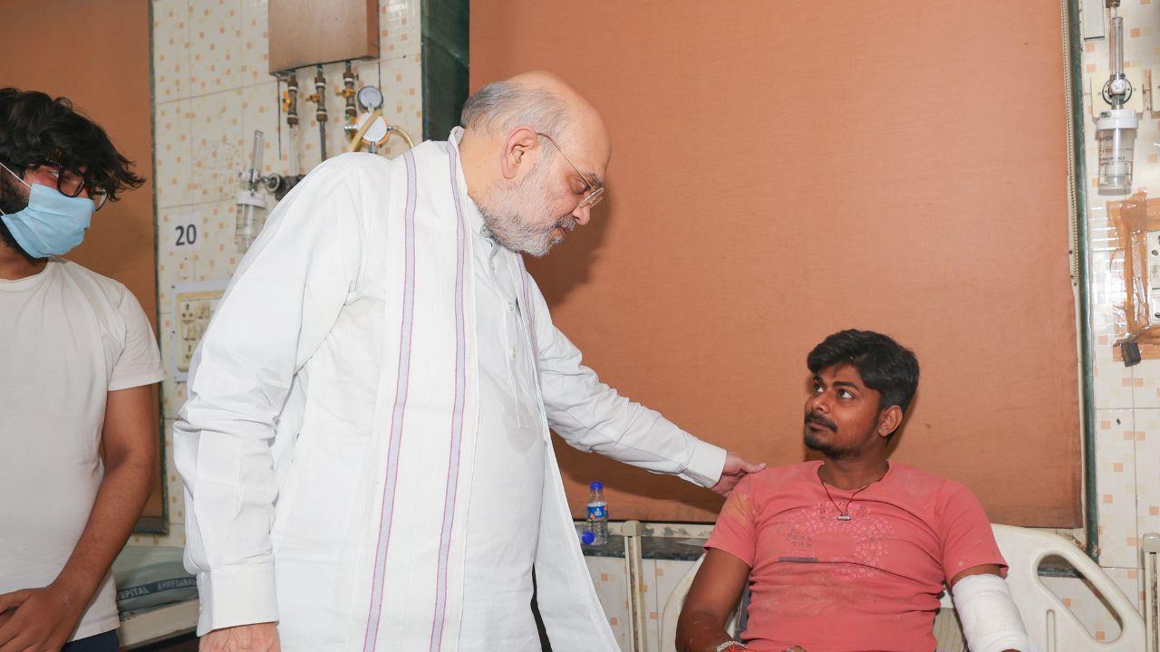 The Union Home Minister also met with those injured on ground after the plane crashed into the complex of a hostel