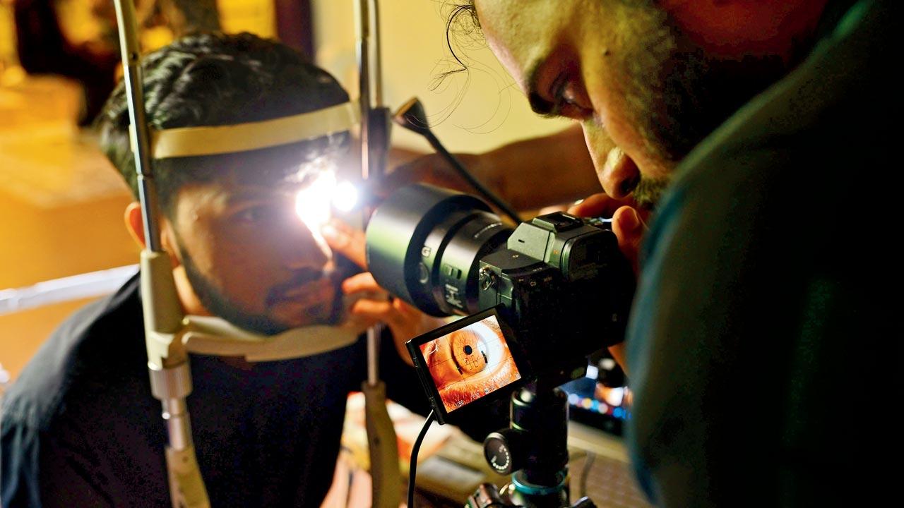 The writer gets his iris scanned by the photographer. Pics/Nimesh Dave