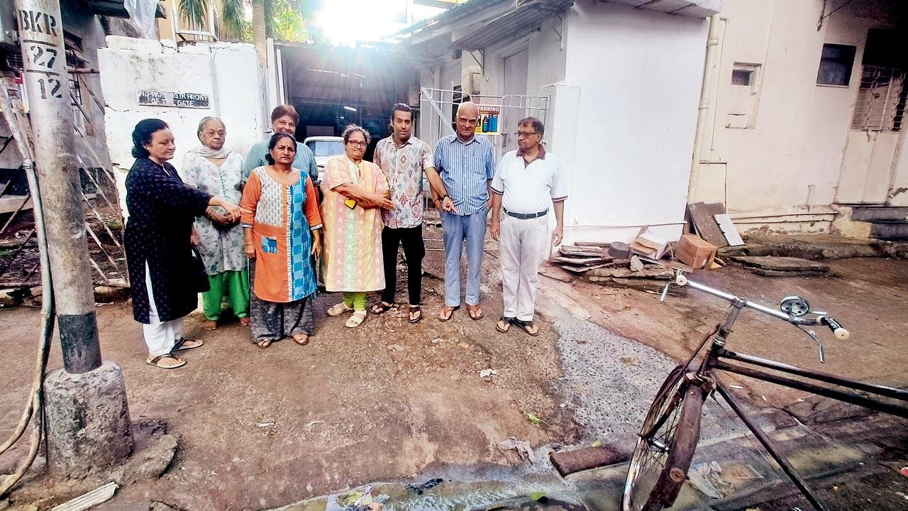 The residents point to the overflowing drainage line from Mani’s Café kitchen