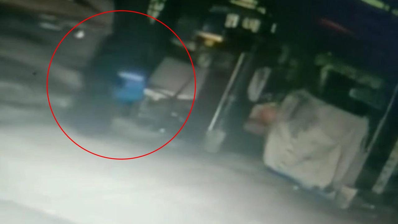 A still from CCTV footage of the child’s mother (encircled) outside the hostel