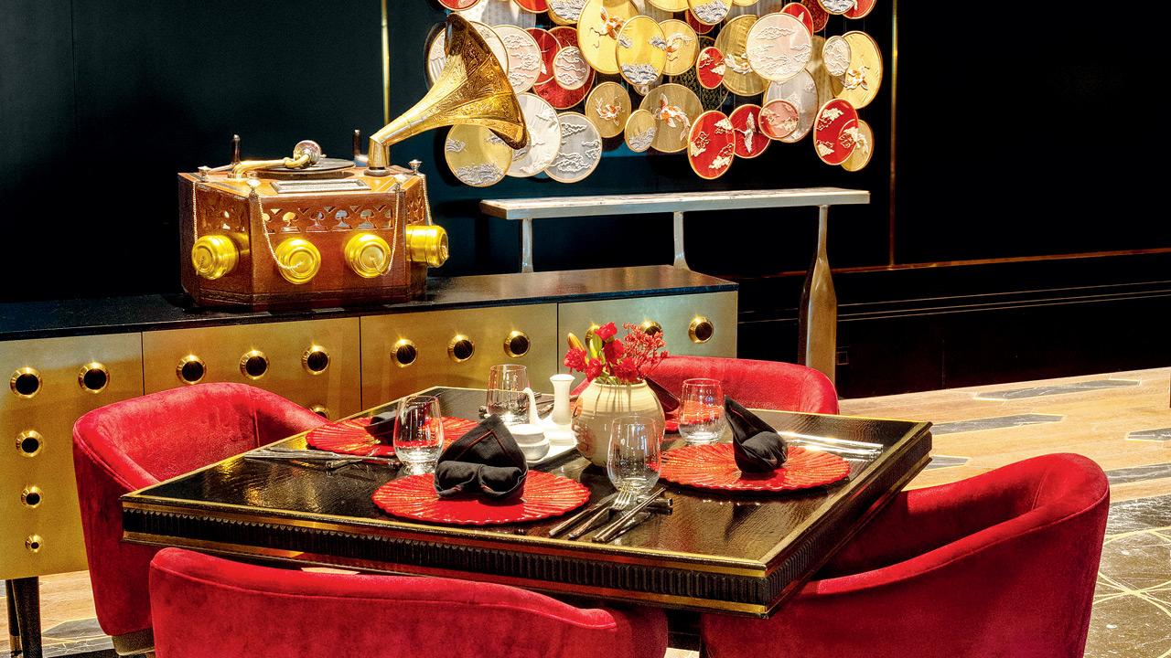 Vintage tiffin boxes, and hand-blown glass bottles, each element referencing Southeast Asia’s shared visual lexicon