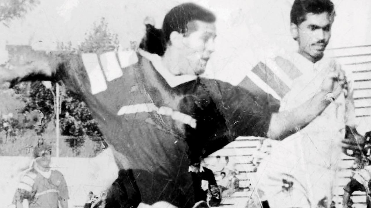 A dated photograph of Vasania (centre) playing as a striker