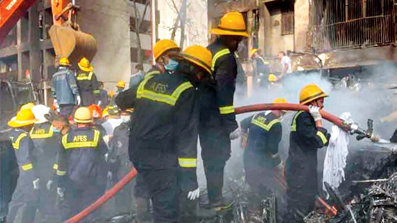 Firefighters work alongside multiple agencies in a race against time to rescue victims and recover bodies from the charred remains