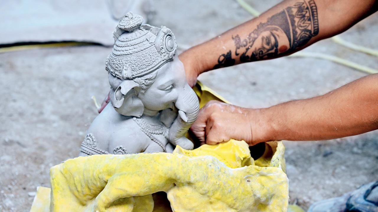 Idols placed along the roadside in Pen to dry before being packed for delivery