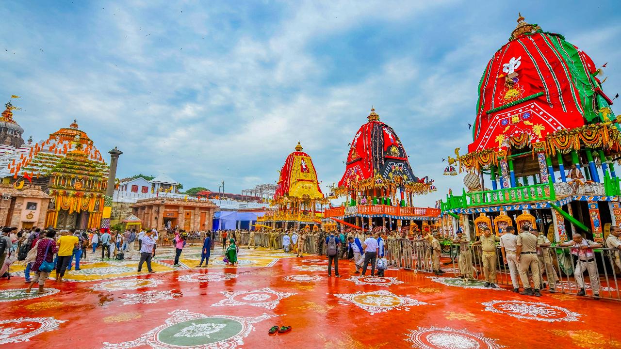 Security personnel keep vigil near the chariots of Lord Jagannath, Lord Balabhadra and Goddess Subhadra on the occasion of the annual 'Rath Yatra' festival, at the Jagannath Temple in Puri, Odisha, Friday, June 27