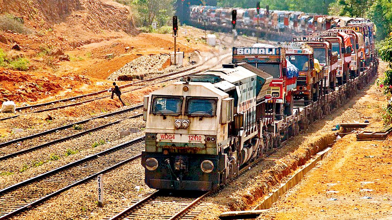 A Konkan Railway Ro-Ro train transports trucks across the route — a service now being considered for cars and SUVs during the Ganapati season. Pics/KR PR Depratment