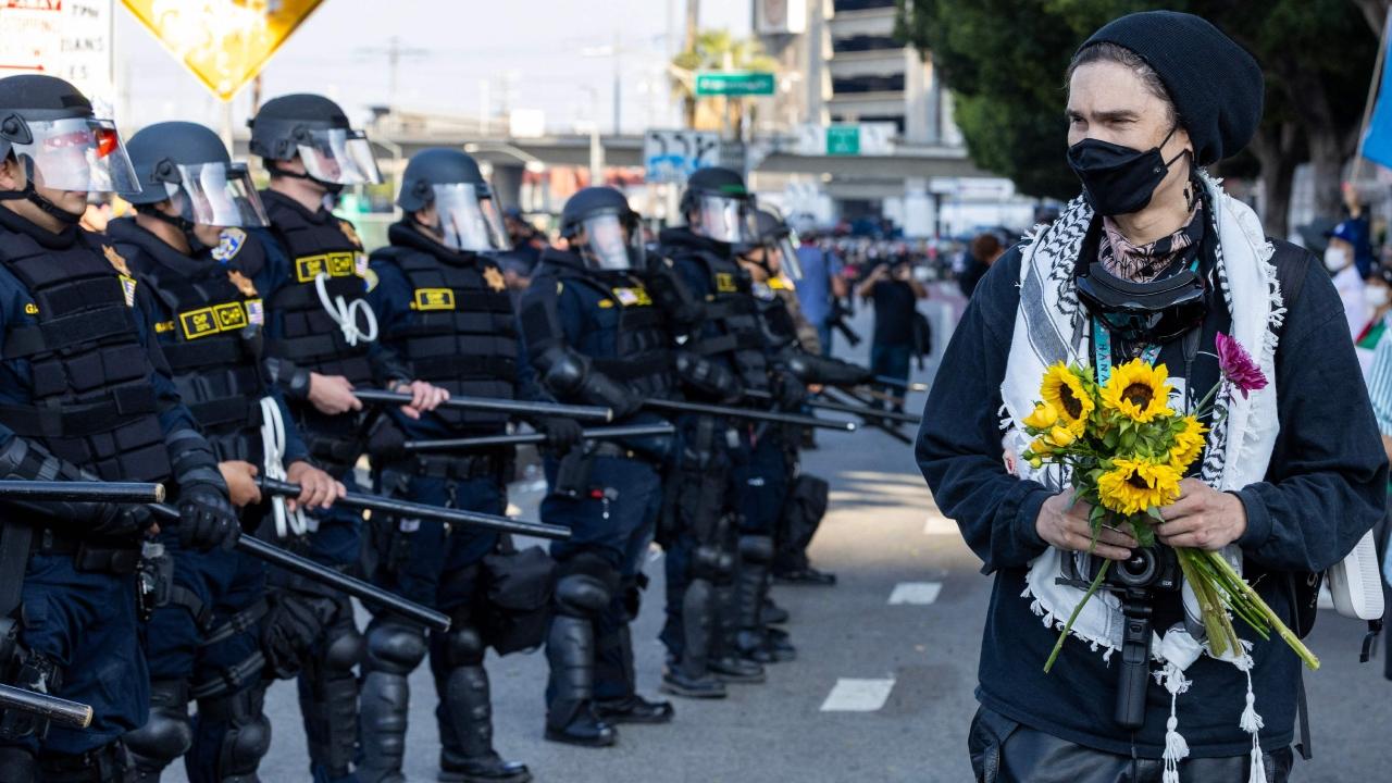 Some police patrolled the streets on horseback while others with riot gear lined up behind Guard troops deployed to protect federal facilities including a detention centre where some immigrants were taken in recent days. Police declared an unlawful assembly, and by early evening many people had left