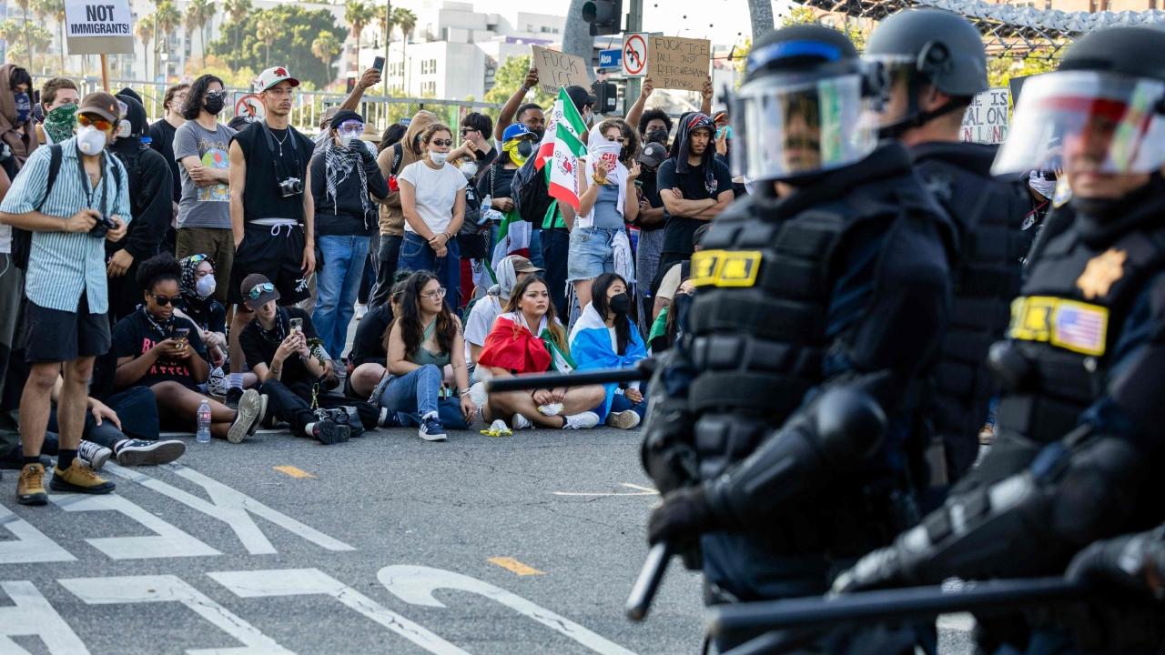 Nearby, at least four self-driving Waymo cars were set on fire, sending large plumes of black smoke into the sky and exploding intermittently as the electric vehicles burned. By evening, police had issued an unlawful assembly order shutting down several blocks of downtown Los Angeles