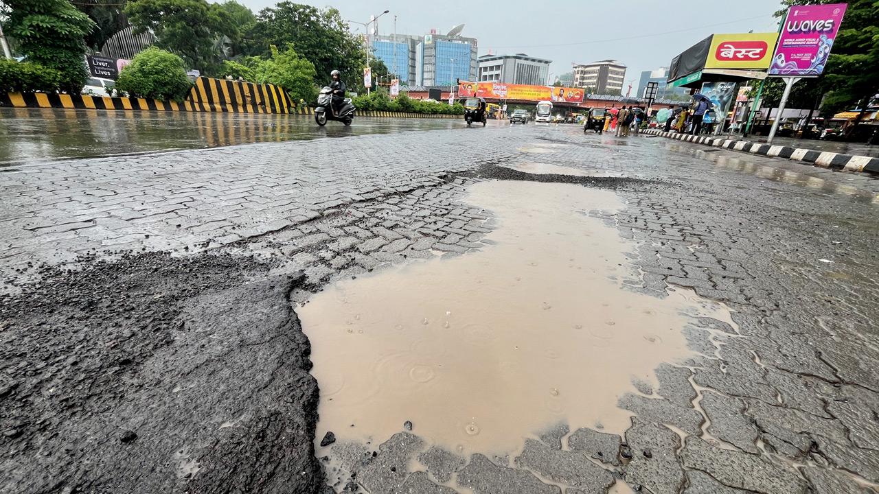 Potholes at Kala Nagar in Bandra East. Pic/Atul Kamble