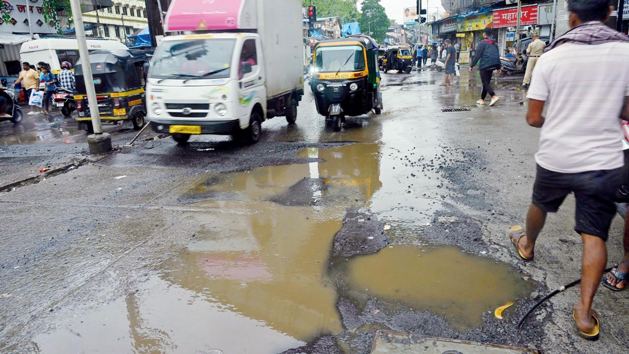 Potholes on SV Road near Andheri railway station. Pic/Atul Kamble