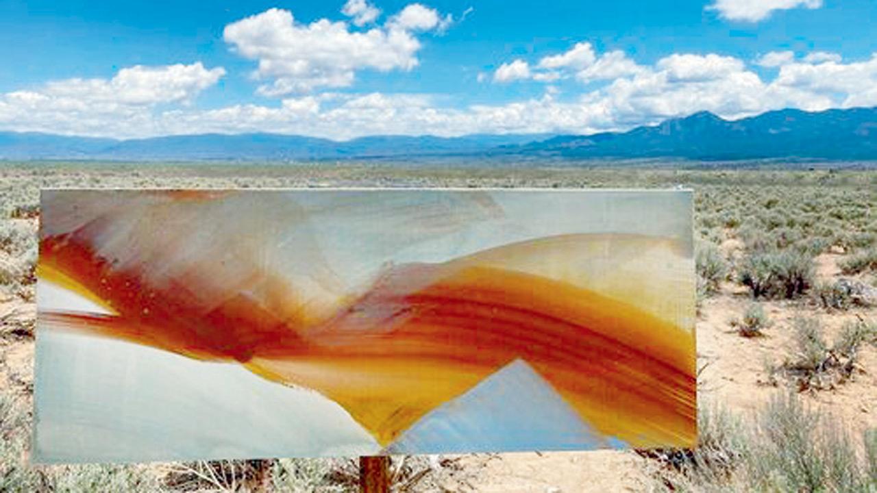 Claire Baker’s art set against the horizon of a desert in New Mexico